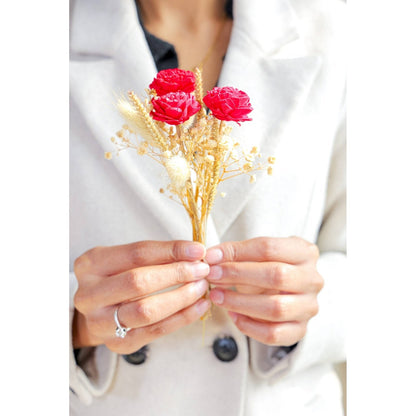 Mini glass bottle vase with red velvet bunch